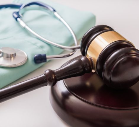 Help With Compensation After A Burn Accident - Gavel and stethoscope in background. Medical laws and legal conc