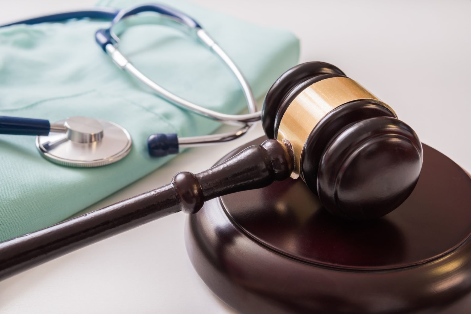 Help With Compensation After A Burn Accident - Gavel and stethoscope in background. Medical laws and legal conc