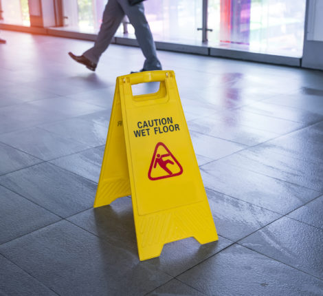 How To Prevent Slip And Fall Accidents - "Caution wet floor" sign