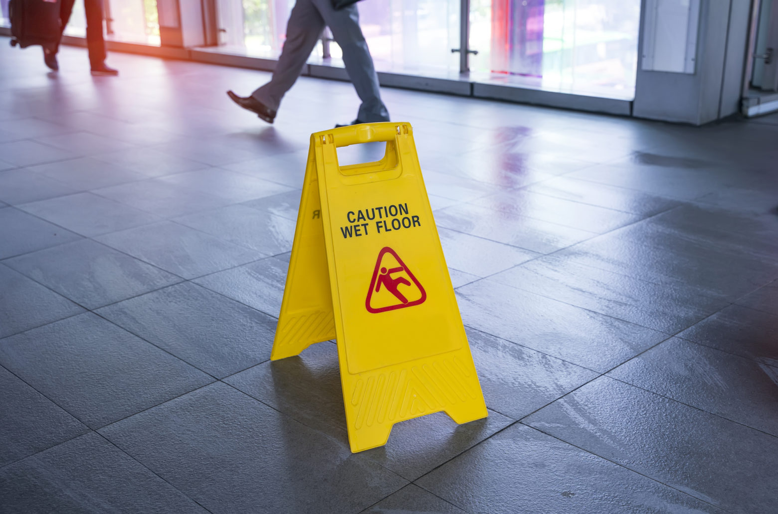 How To Prevent Slip And Fall Accidents - "Caution wet floor" sign