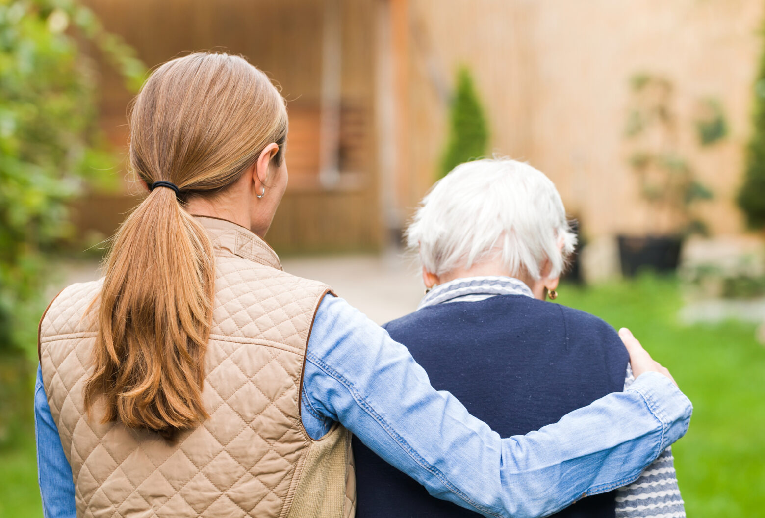 What Is Elder Law? - Elderly care Young carer walking with the elderly woman in the park
