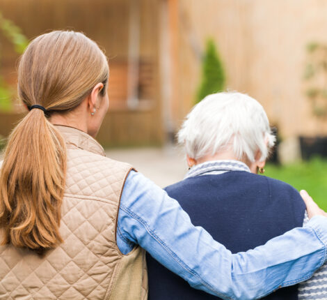 What An Elder Law Lawyer Can Do - Young carer walking with the elderly woman in the park